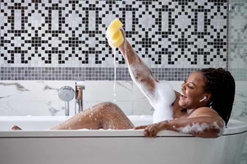 Woman taking bubble bath 