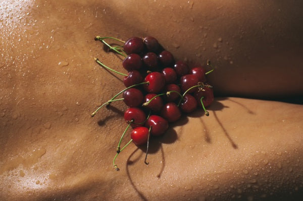 Woman with cherries on her private parts 